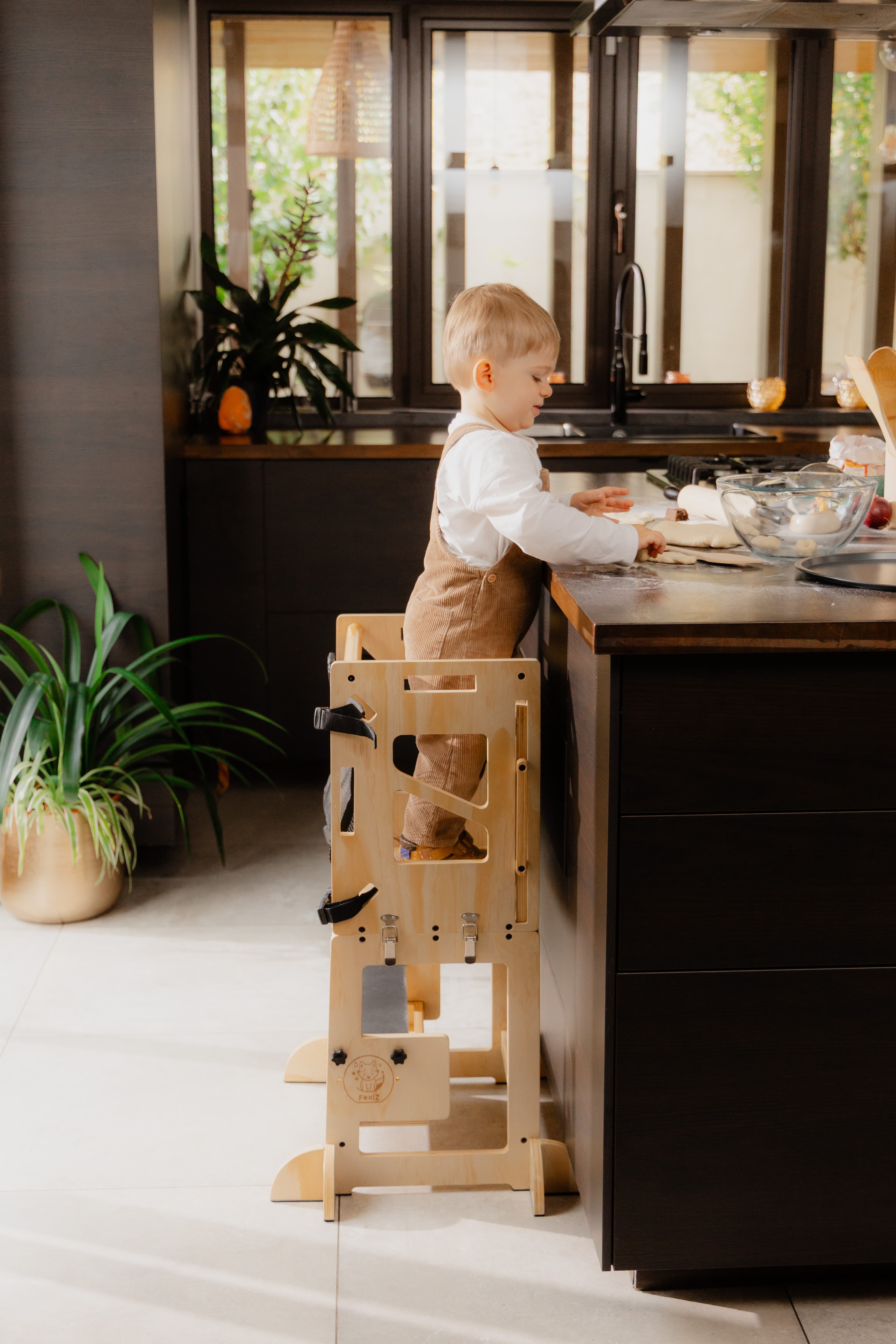 Child using the Foxiz tower independently